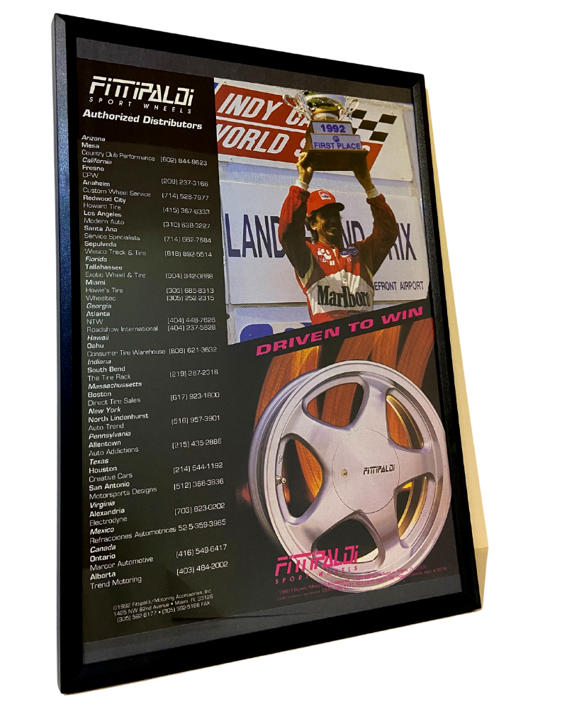 Fittipaldi driven to win framed ad